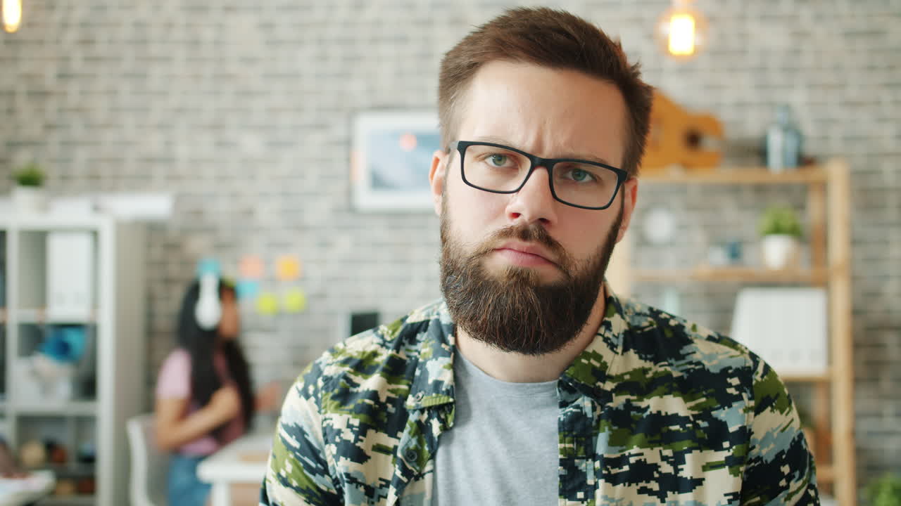 Man in Office Looking Unhappy