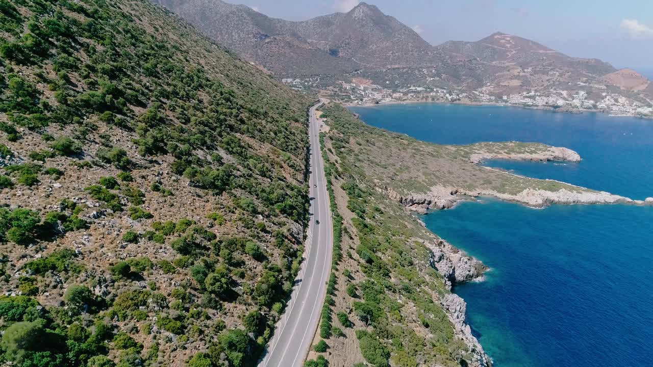 A shot from a drone of a road on the coast of the Greek island of Crete