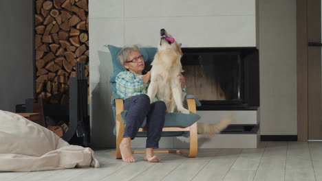 woman and golden retriever at home