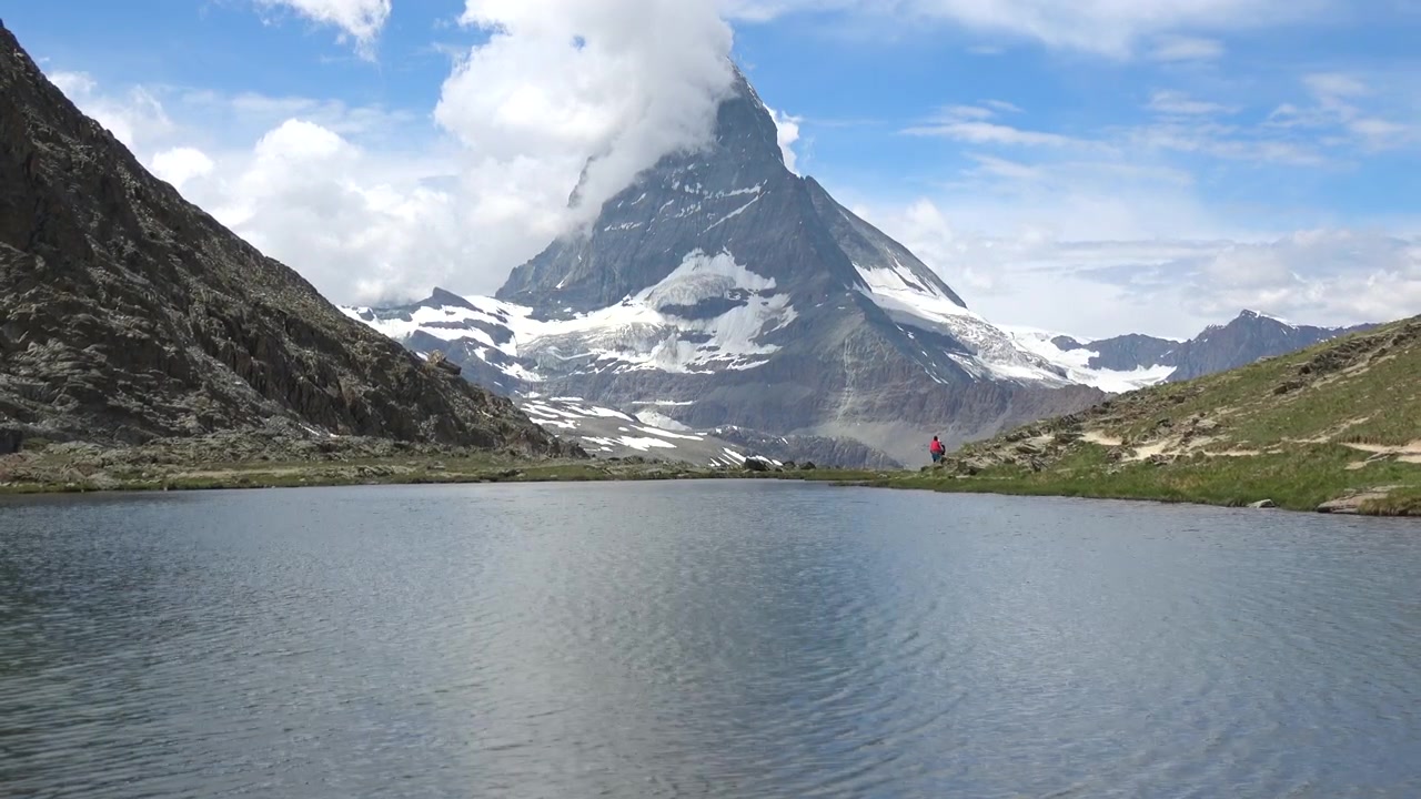 Snowy Matterhorn summit reflected in tranquil lake Stellisee near Zermatt, Switzerland