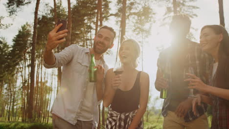 Smiling-friends-sending-greetings-on-camera-outside.-Guys-having-video-call