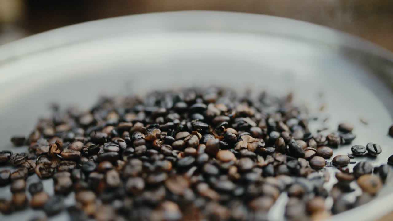Close-up slow motion shot of robusta coffee beans being roasted