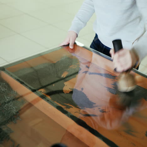iron filings in a magnetic field. boy conducts research experience. square video