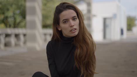 woman sitting outdoors