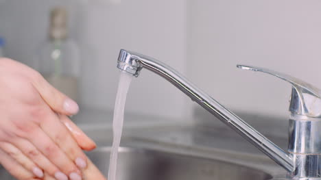 Washing-And-Disinfecting-Hands-In-Sink-3