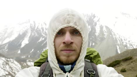 young man in the mountains of nepal. manaslu circuit trek, 4500 m altitude.
