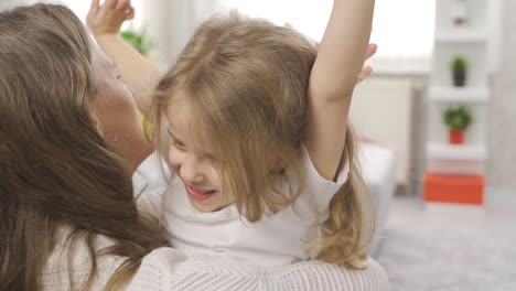 child girl hugging her mother in slow motion.