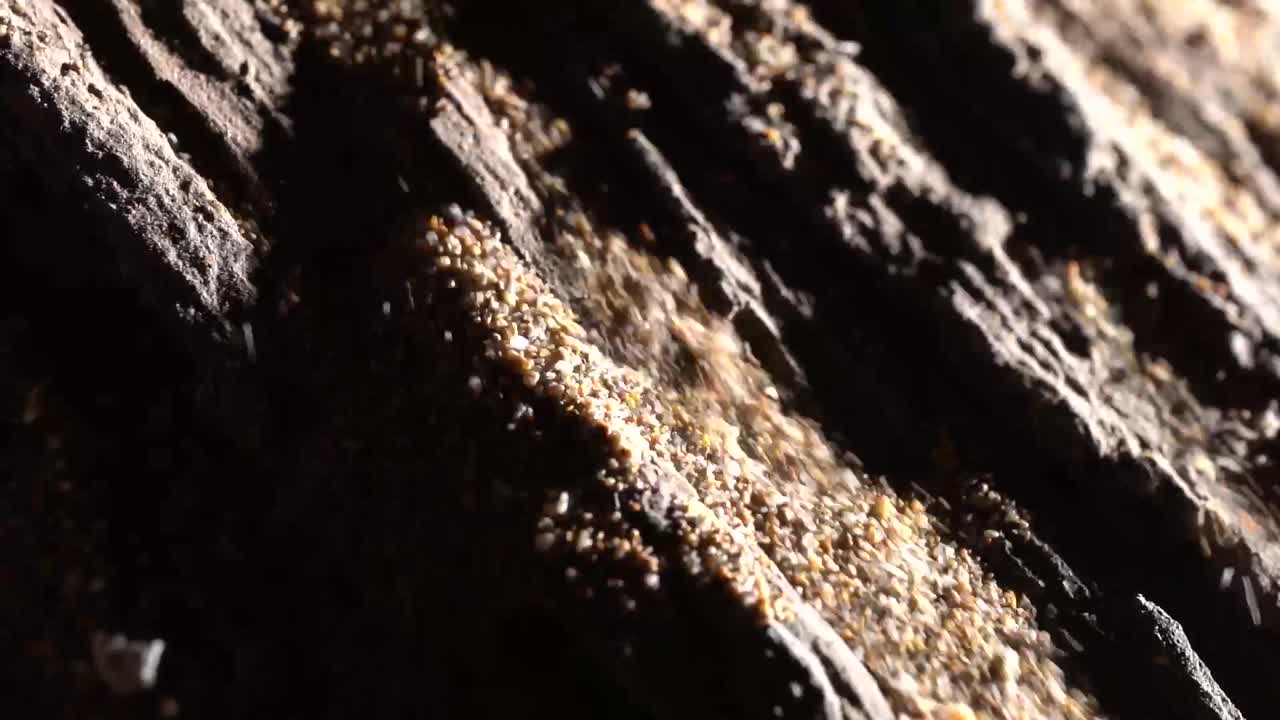 Macro Shot Of Sand Grains Falling During A Landslide, Natural Beauty Of Raw Materials.