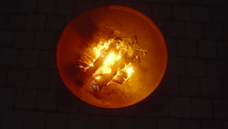 Fiery-display-in-hot-bonfire-bowl-creates-an-intense-and-mesmerizing-scene