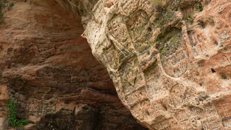 view at largest yellow-brown sandstone rock cave wall, sigulda latvia