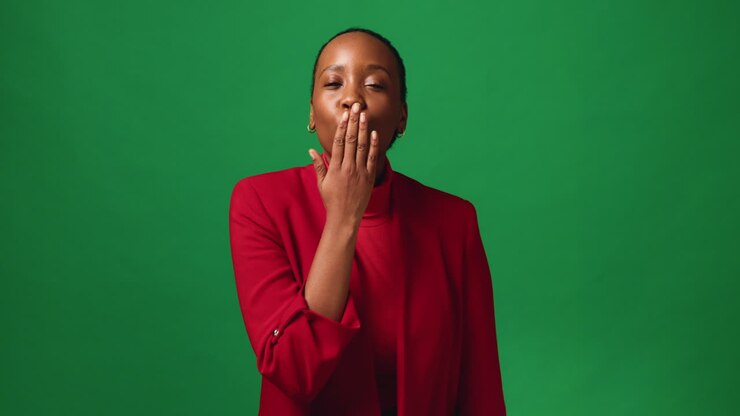 Portrait of a cheerful woman in a red blazer