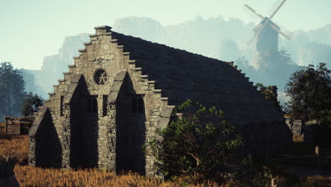 medieval stone building in foggy landscape