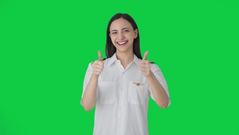 Happy-Indian-woman-pilot-showing-thumbs-up-Green-screen