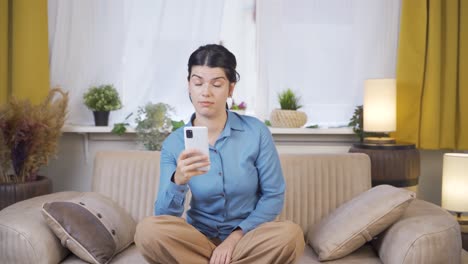 Young-woman-looking-negative-at-camera.