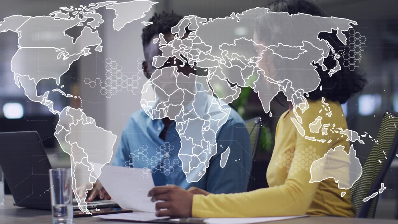 Woman and man reviewing docs and typing on laptop in business input activating network map overlay