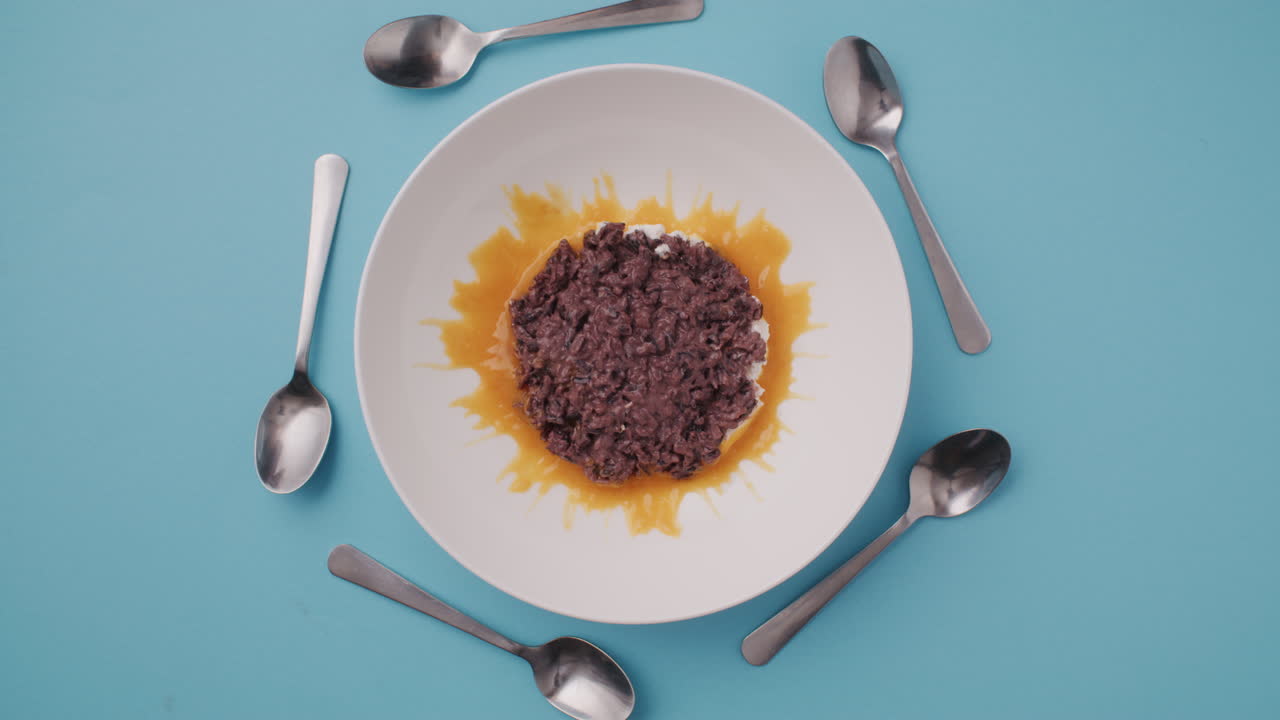 Black Rice Dessert with Orange Sauce