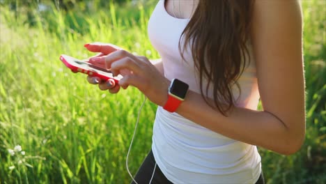 woman using phone during outdoor workout