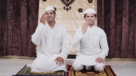 happy indian muslim men doing adab greetings