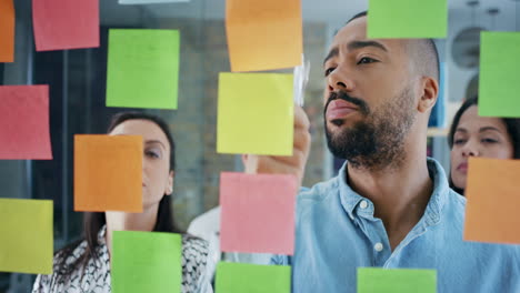 creative business team brainstorming ideas working together sharing data late at night after hours in modern glass office