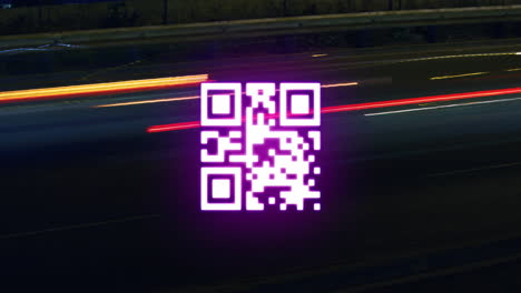 QR code scanner against light trails on black background