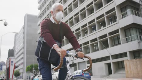 caucasian man out and about in the street wearing on a face mask against coronavirus