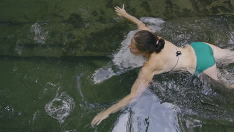 woman swimming in a river