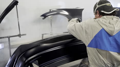 car body painting in a repair shop