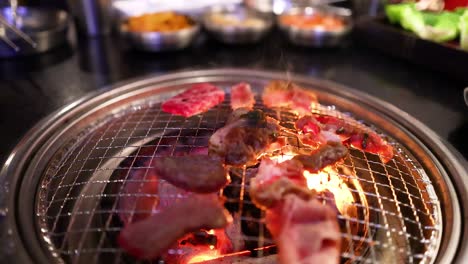 grilling pork and beef on a barbecue