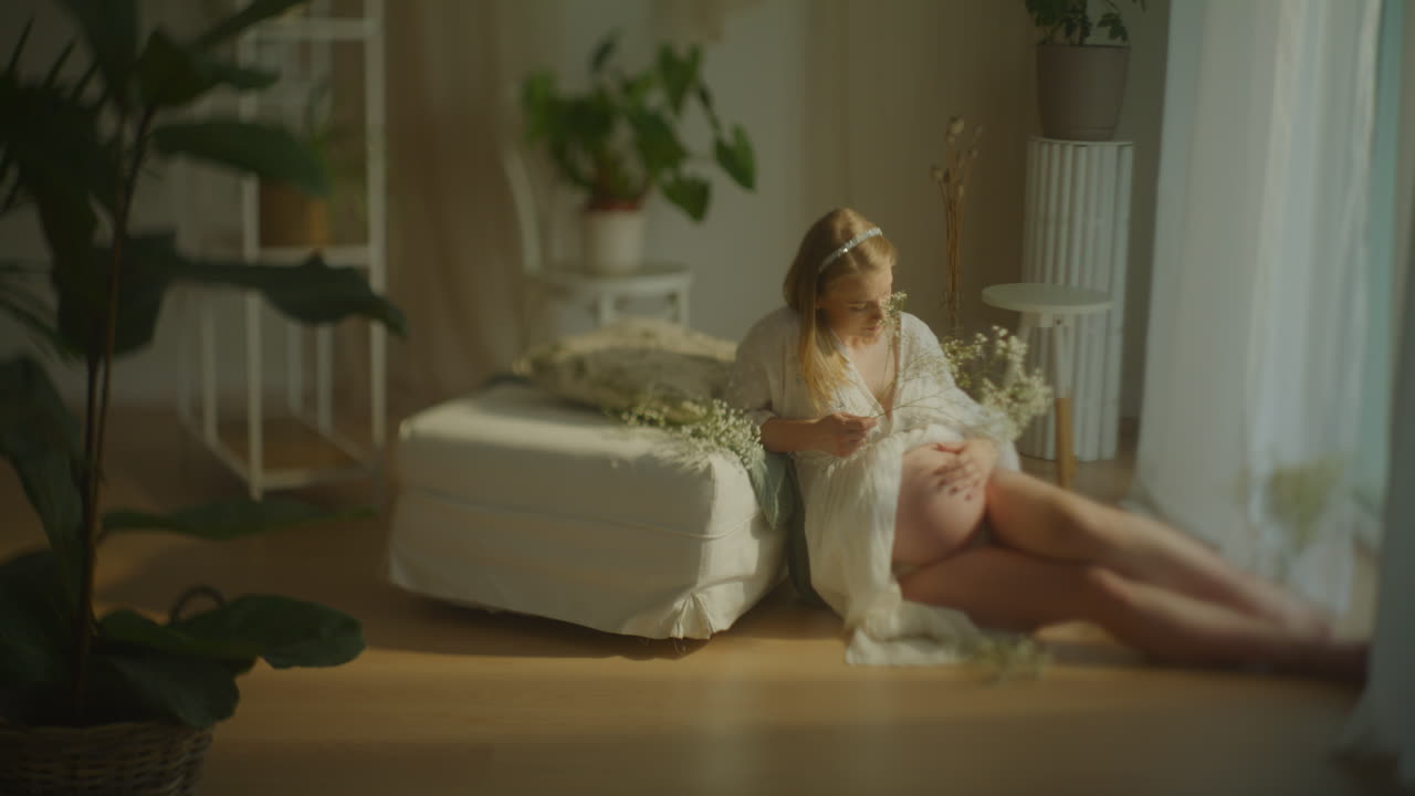 Pregnant Woman Lying Sensually with Flowers