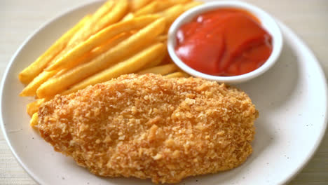 fried chicken breast fillet steak with french fries and ketchup