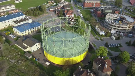 aerial of industrial city district and round gas warehouse building