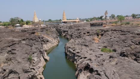 Aerial-drone-footage-of-a-river-with-potholes---At-Nighoj-near-Pune-and-is-famous-for-the-naturally-created-potholes-on-the-riverbed-of-the-Kukadi-River