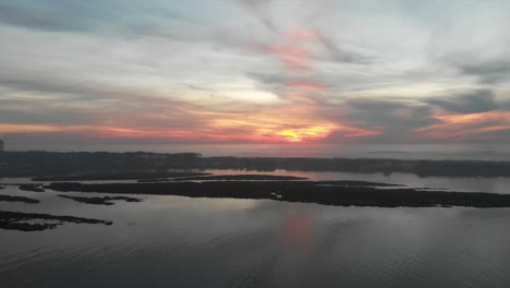 Aerial-shot-of-the-river-at-sunset