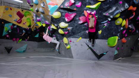 teenagers bouldering in a gym