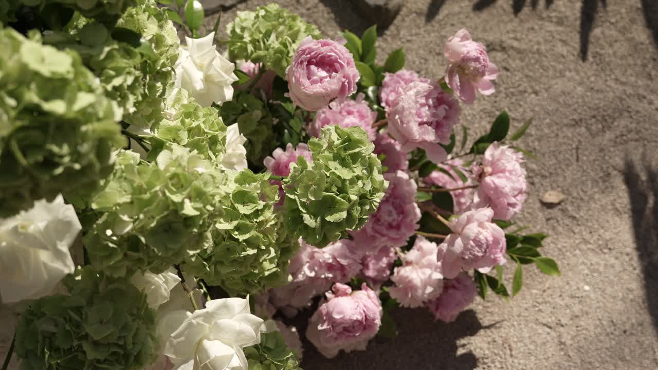 pastel blooms lying on warm sand under gentle daylight