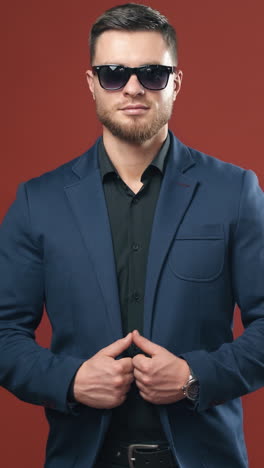 man posing on studio background. portrait of handsome man in glasses. vertical video