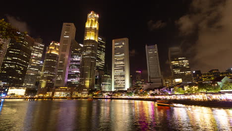 singapore - 5 march 2025 : timelapse of the singapore central business district skyline reflected in the river at night