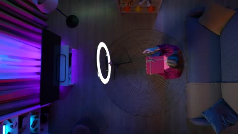 woman reading at night with ring light