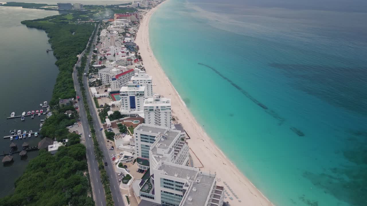 Aerial of Cancun Mexico riviera Maya drone fly above hotel zone with white sand tropical Caribbean Sea beach