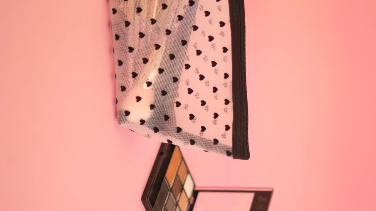 Makeup Bag with Heart Pattern on Pink Background