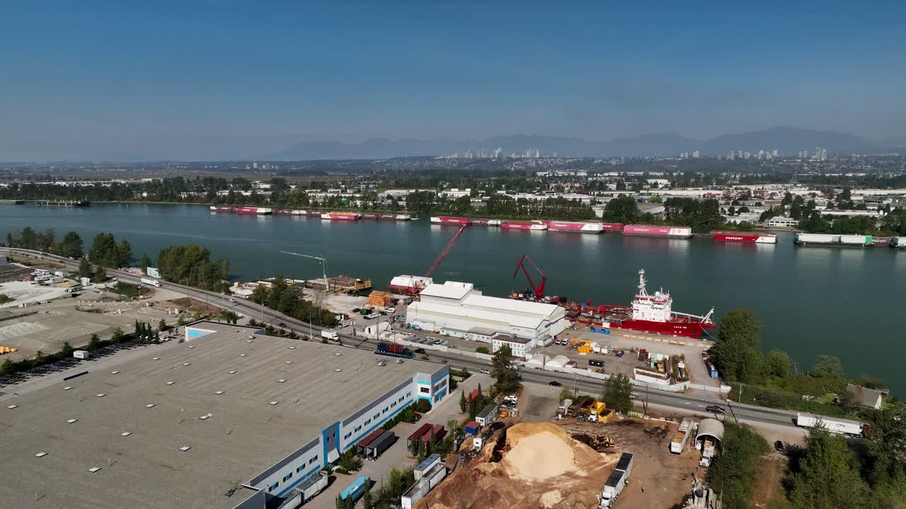 Cars Driving In The Road Along The Vito's Dock In Fraser River In Delta, BC, Canada