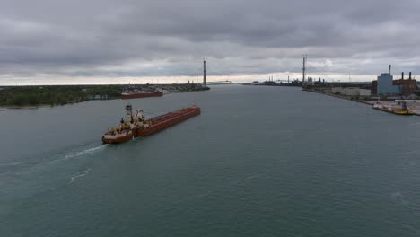 Drone-view-of-large-tanker-in-the-Detroit-River-in-Detroit,-Michigan