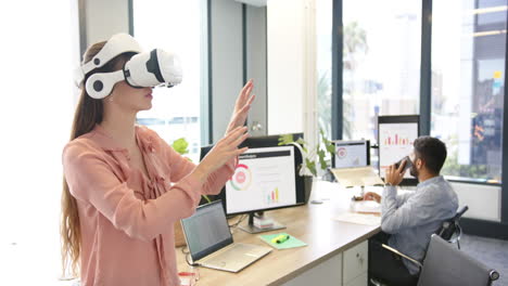 using vr headset, woman exploring virtual environment in modern office setting
