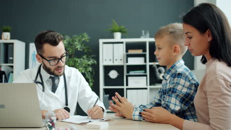 doctor discussing with child and mother