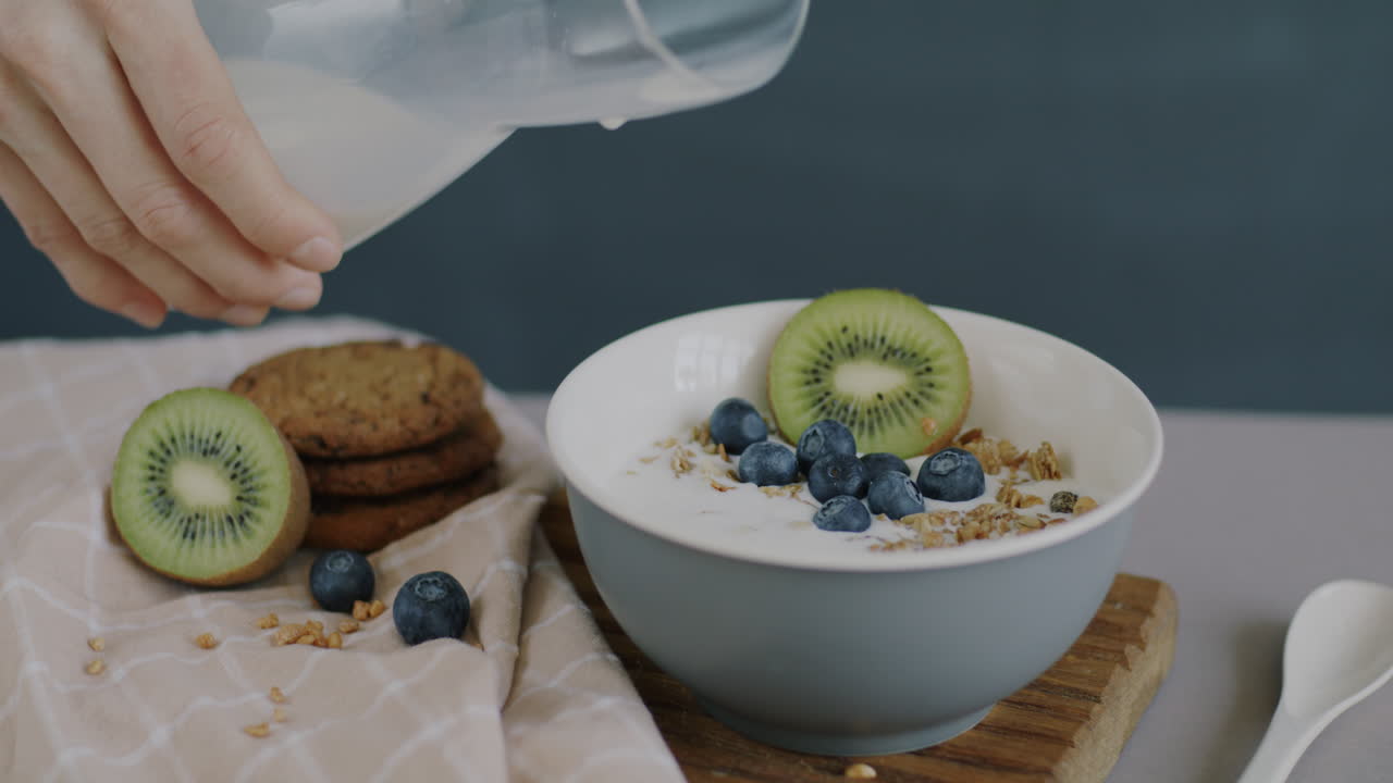 Healthy Breakfast with Granola, Milk, and Fruit