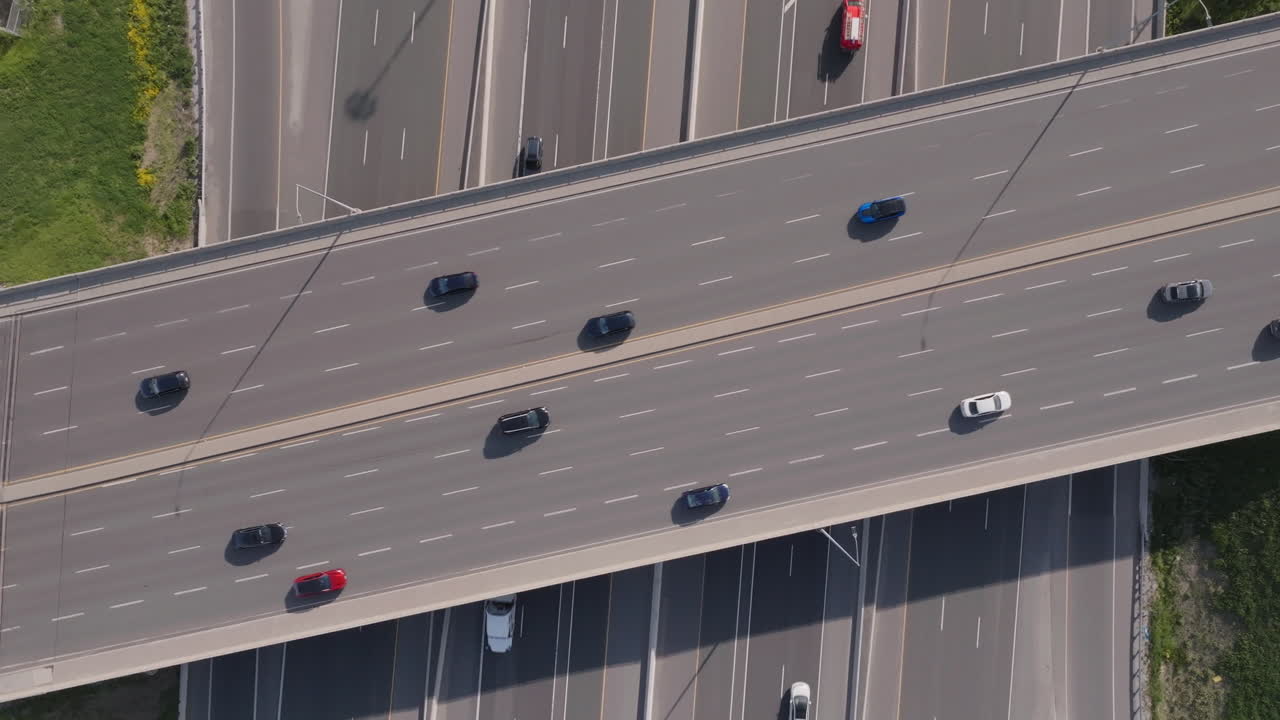 Cars moving on highway 401 in mississauga, canada, in slow motion, aerial view