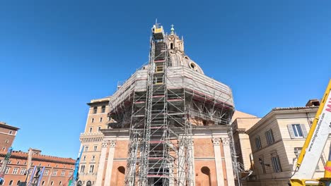 timelapse of a building's restoration in a bustling square