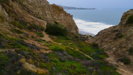 flying-through-blacks-beach-cliffs