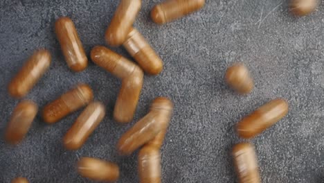 brown capsules on a gray surface