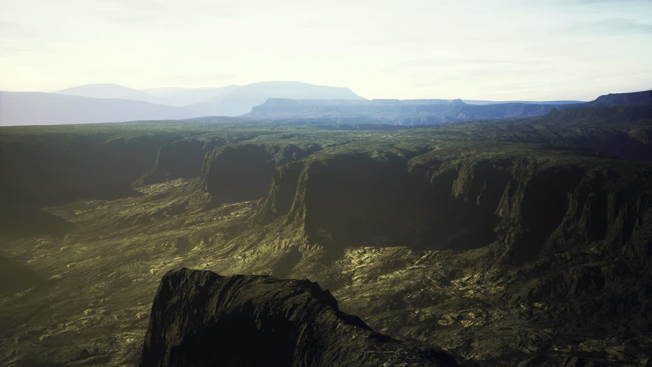 Majestic mountain landscape with deep valleys and sunlight at dawn